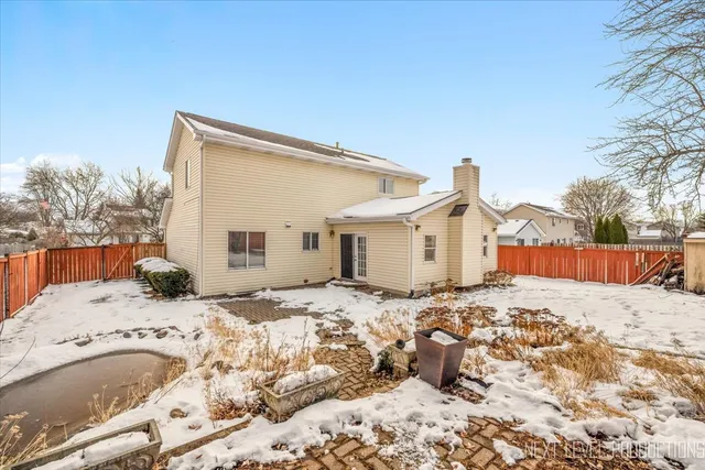 a view of a house covered in snow