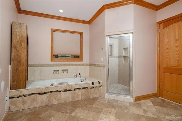a bathroom with a tub and a shower