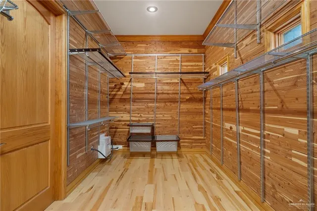 a view of a balcony with wooden floor and iron stairs