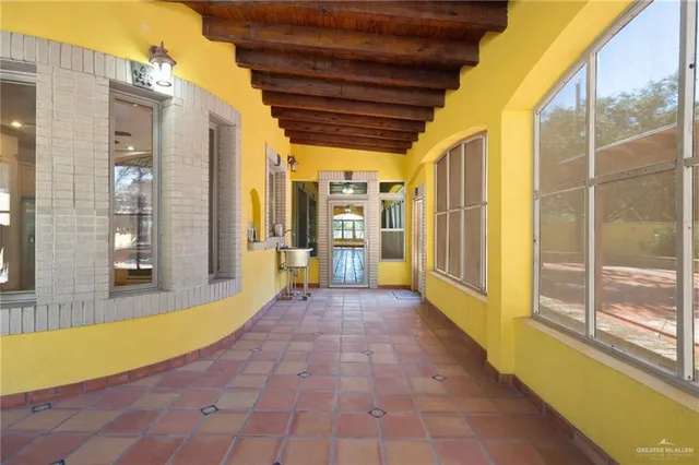 a view of a bathroom with a tub and a large window