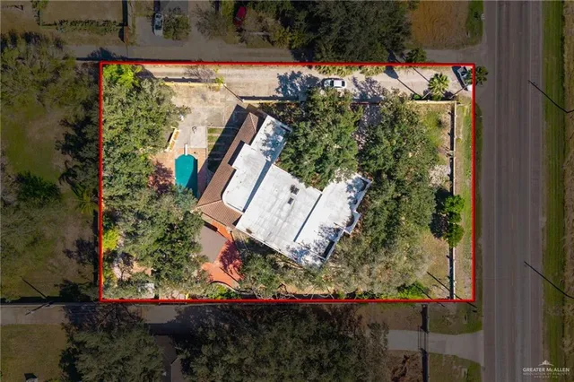 an aerial view of a house with a swimming pool