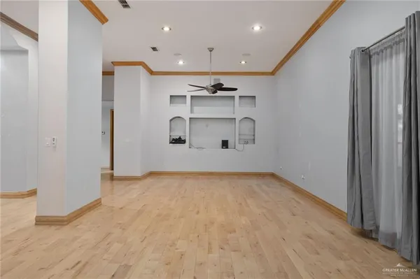 a view of an empty room with a cabinet