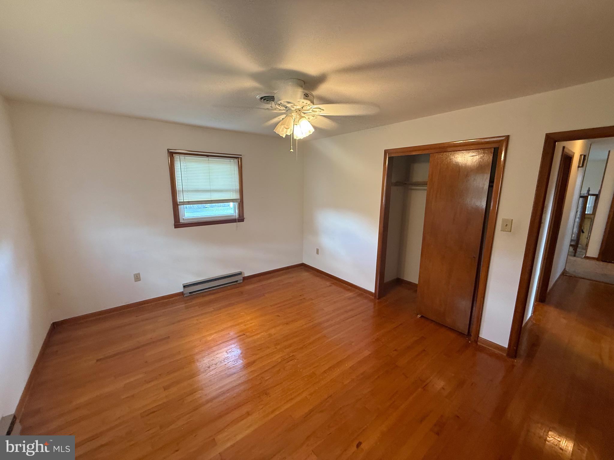 384 Fairview Drive Berkeley Springs, WV 25411 - Photo 12 of 24 a view of empty room with wooden floor