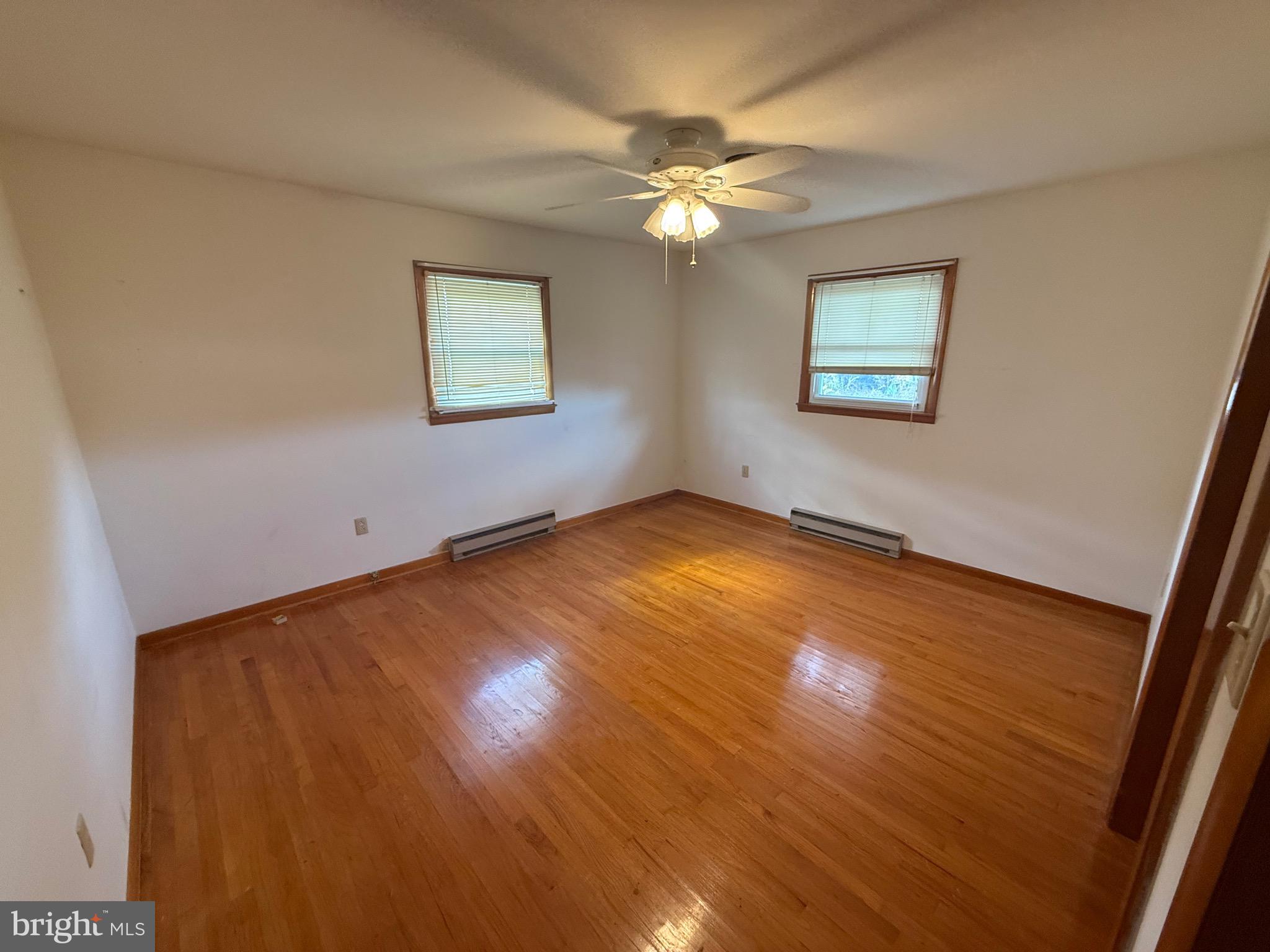 384 Fairview Drive Berkeley Springs, WV 25411 - Photo 13 of 24 a view of a room with wooden floor and chandelier