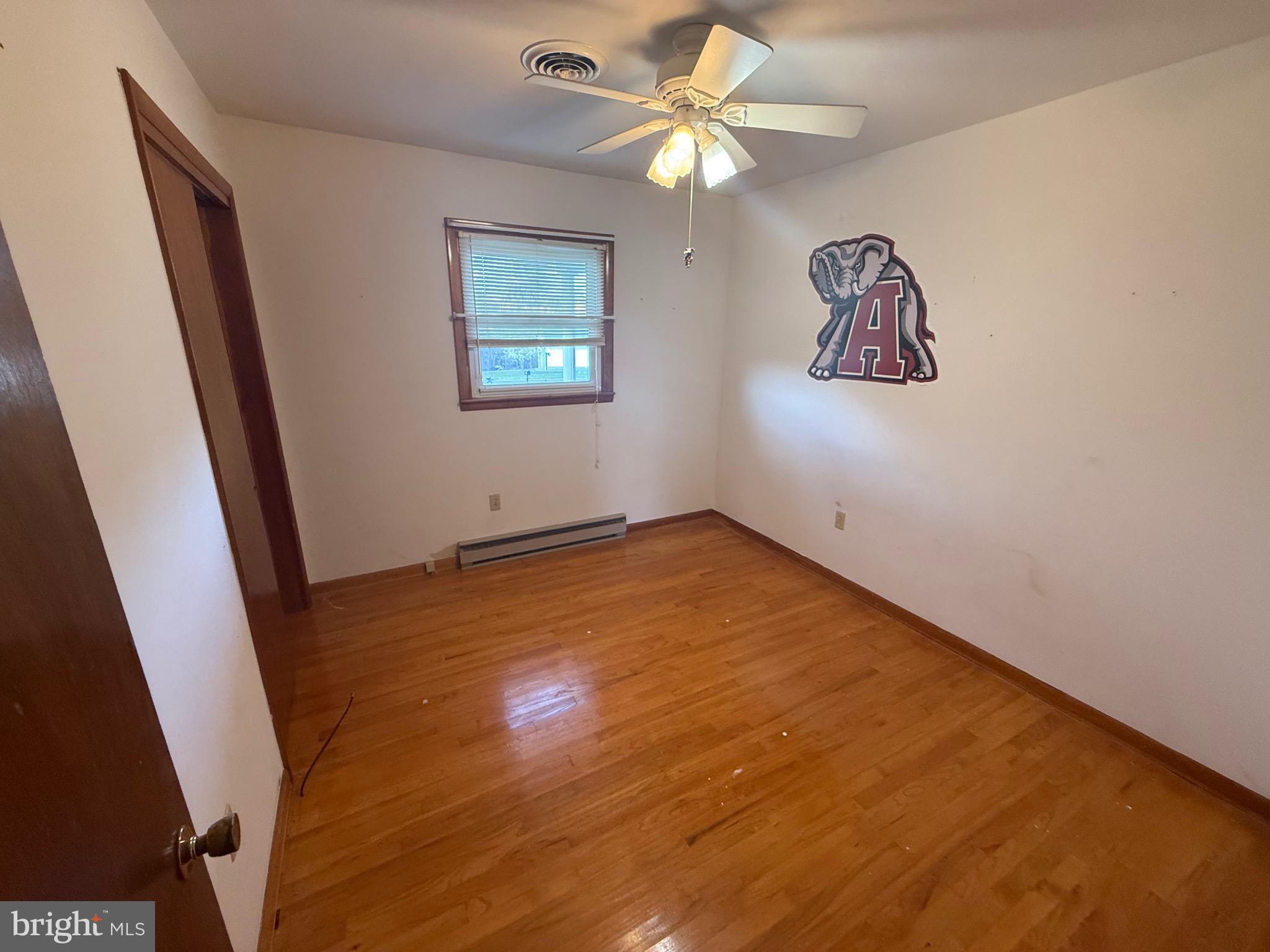 384 Fairview Drive Berkeley Springs, WV 25411 - Photo 14 of 24 an empty room with a fan & a window