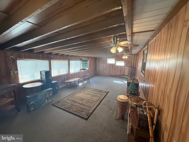 a view of a livingroom with furniture and window