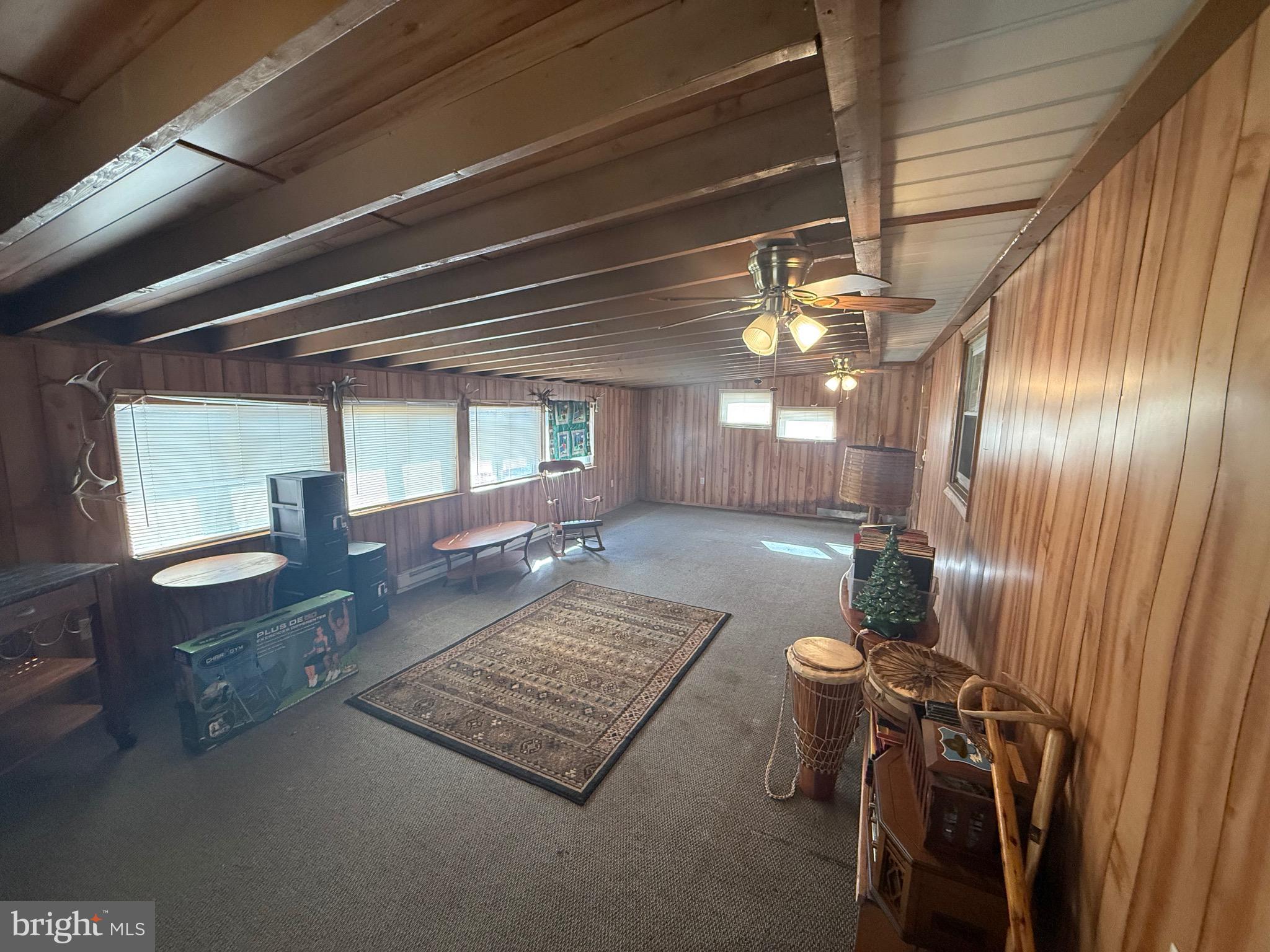 384 Fairview Drive Berkeley Springs, WV 25411 - Photo 16 of 24 a view of a livingroom with furniture and window
