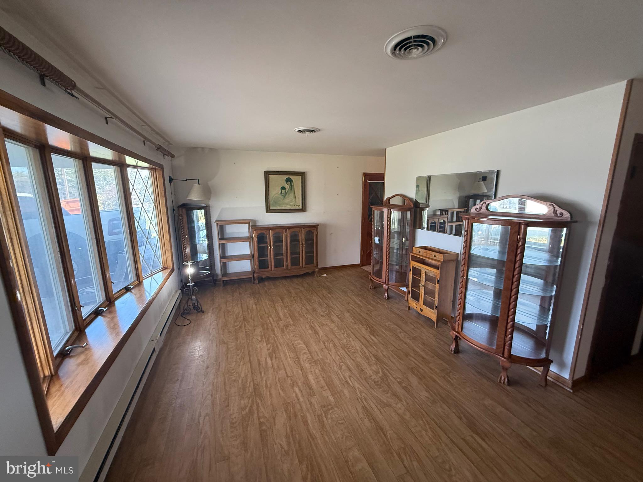 384 Fairview Drive Berkeley Springs, WV 25411 - Photo 20 of 24 a view of a livingroom with furniture and hardwood floor