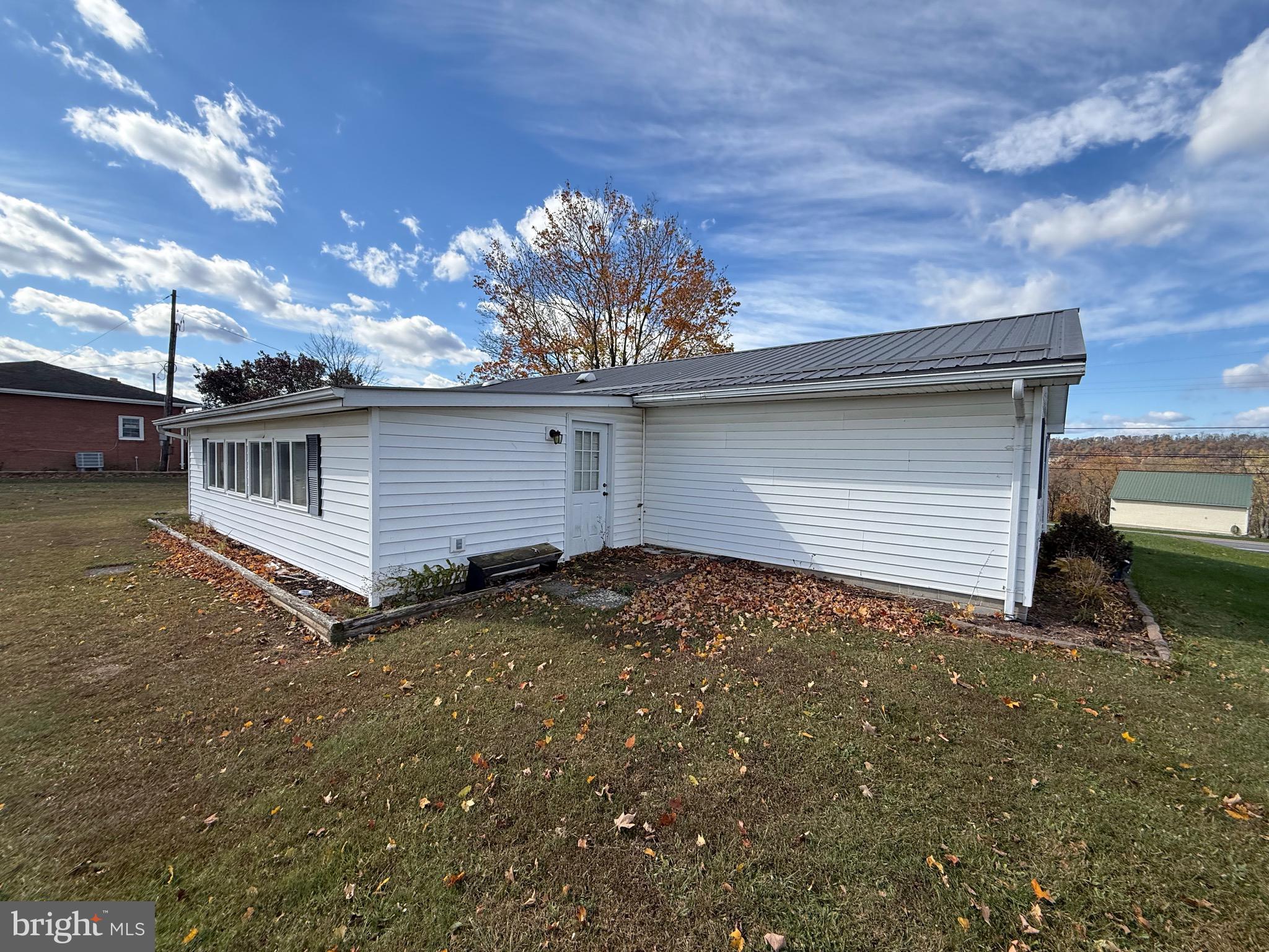 384 Fairview Drive Berkeley Springs, WV 25411 - Photo 3 of 24 a view of a house with a backyard