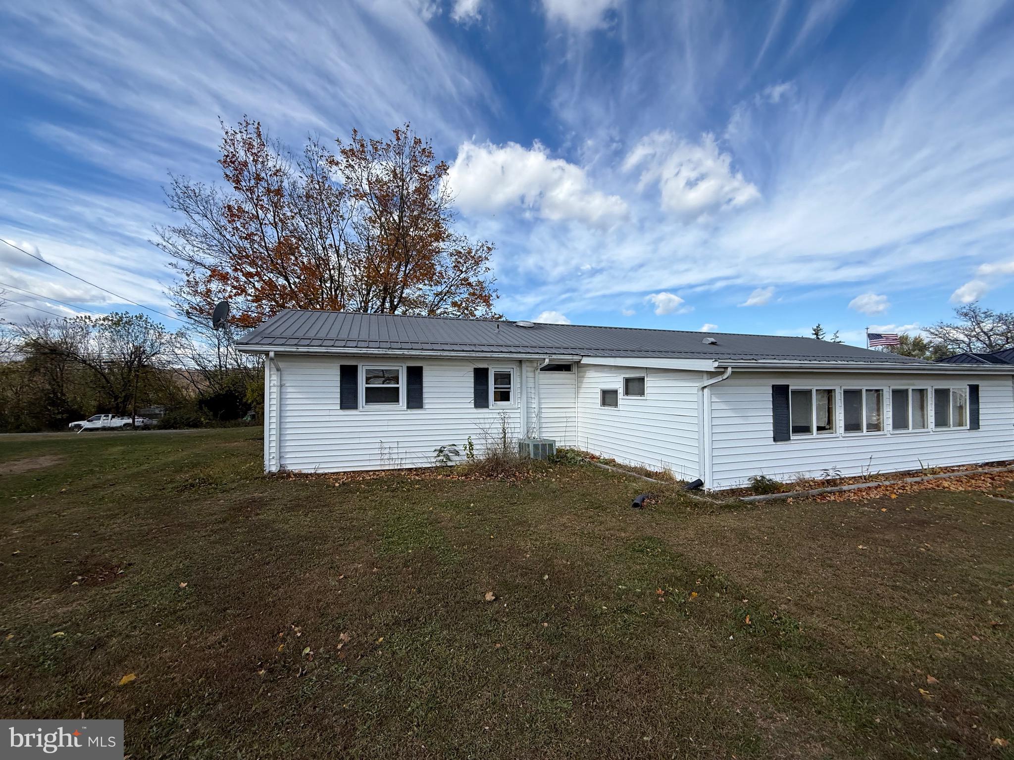 384 Fairview Drive Berkeley Springs, WV 25411 - Photo 5 of 24 a front view of house with yard and trees