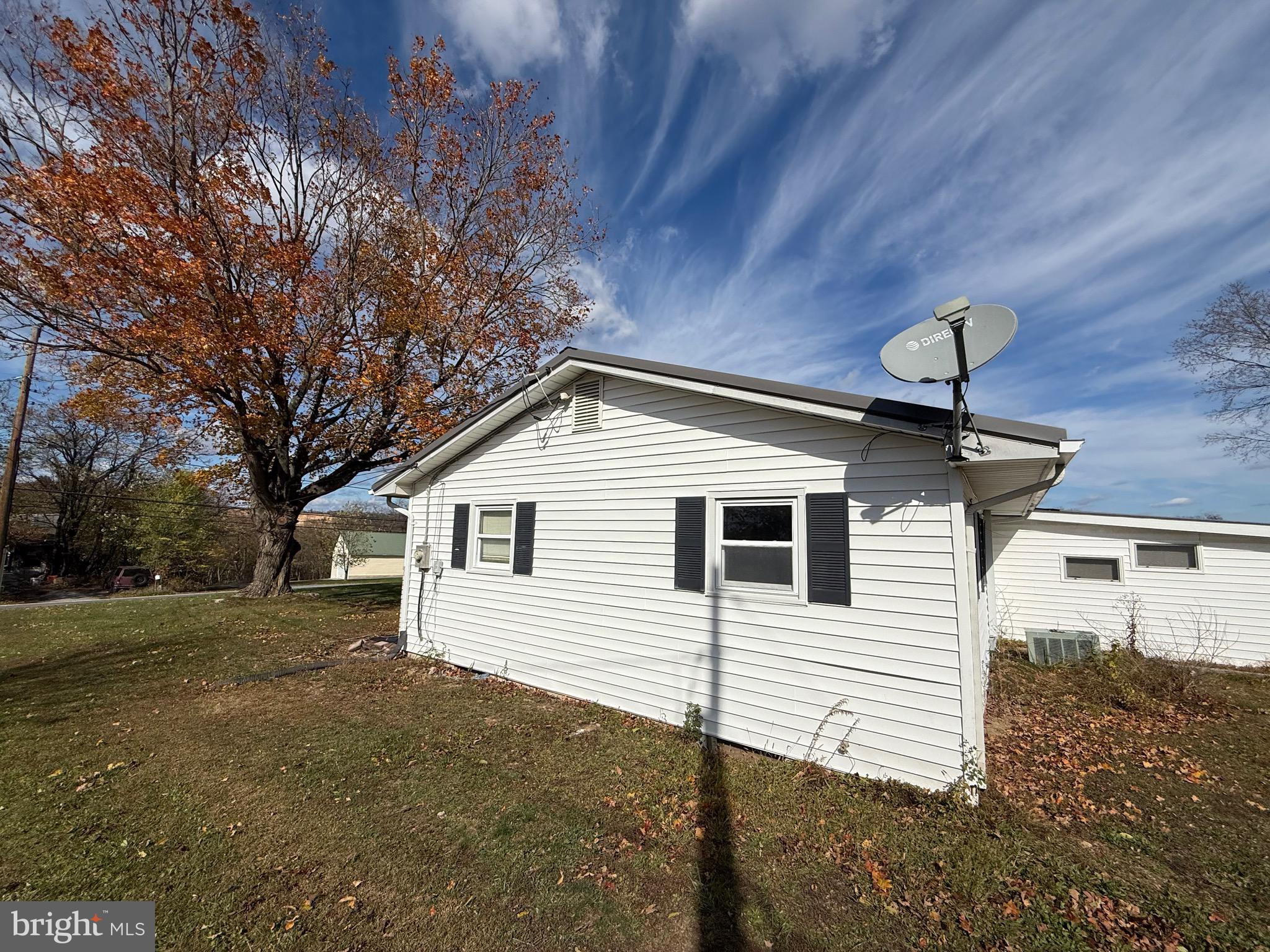 384 Fairview Drive Berkeley Springs, WV 25411 - Photo 6 of 24 a view of a house with a yard