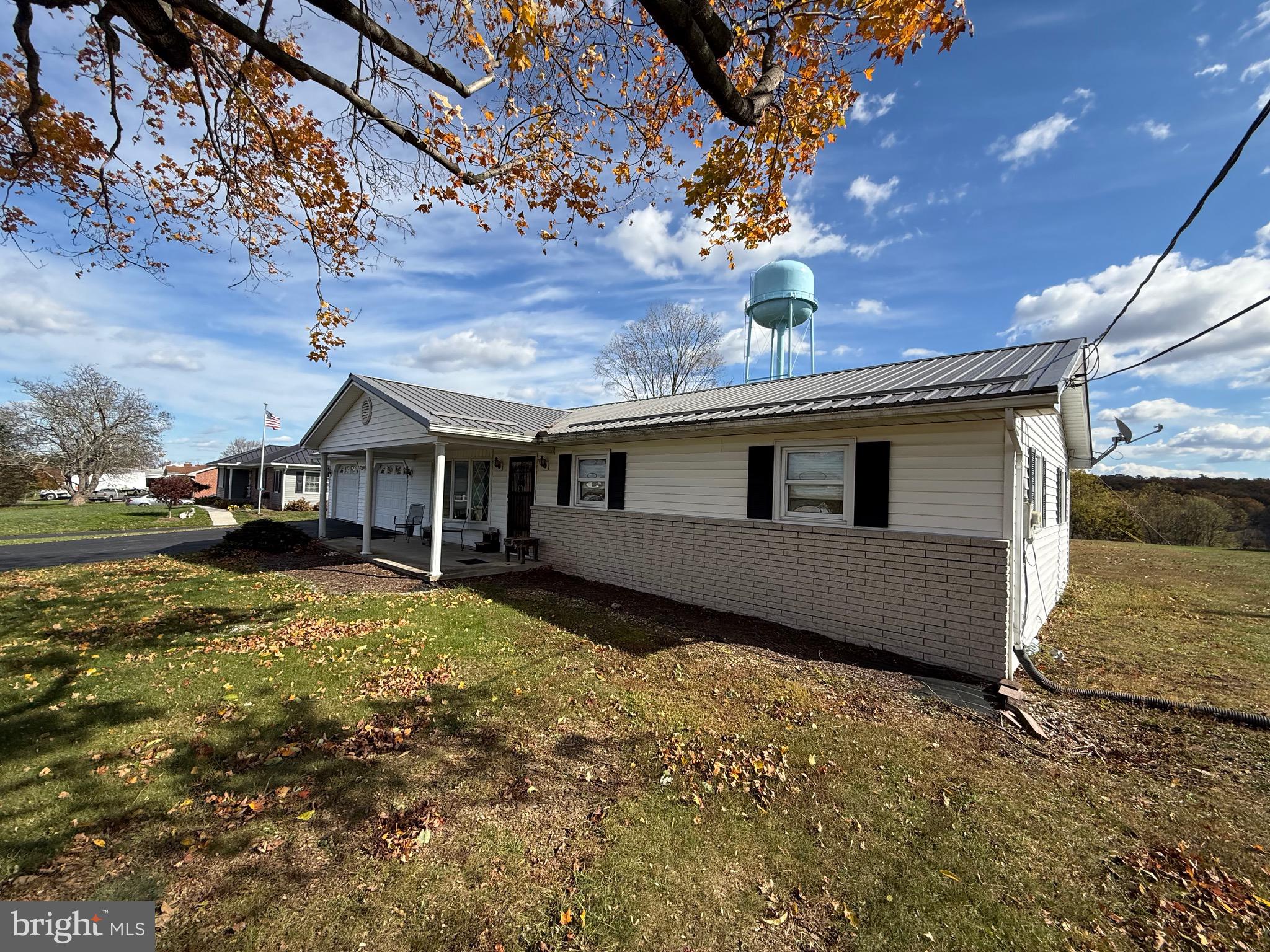 384 Fairview Drive Berkeley Springs, WV 25411 - Photo 7 of 24 a front view of house with yard
