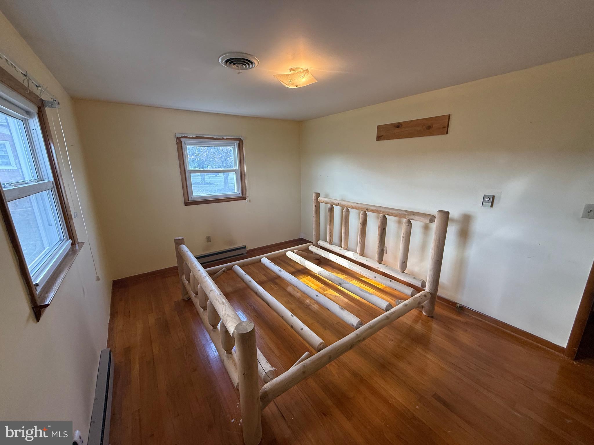 384 Fairview Drive Berkeley Springs, WV 25411 - Photo 9 of 24 a view of room with window and wooden floor