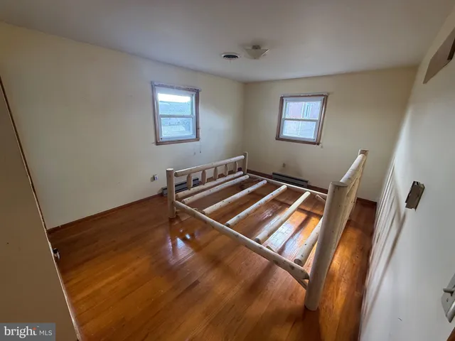 a view of an empty room with windows