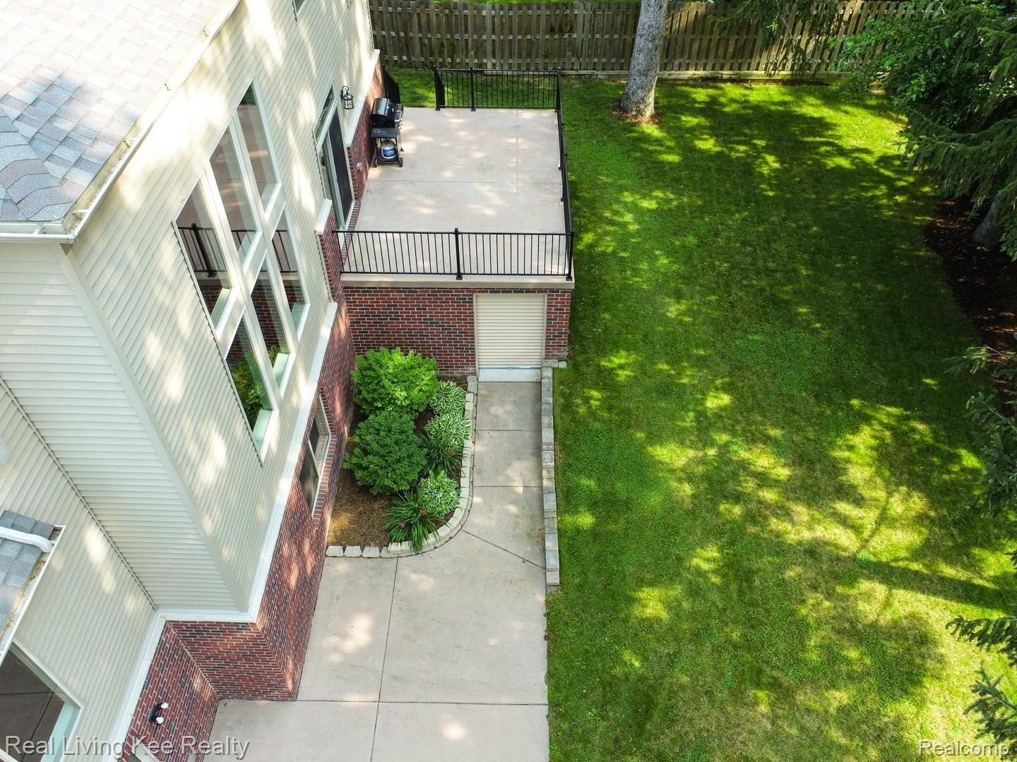 557 Curzon Road Rochester, MI 48307 - Photo 59 of 66 Exterior and interior access to bonus garage/workshop under patio