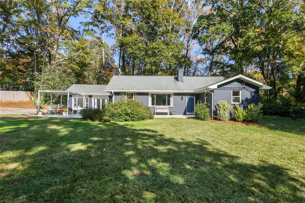 331 Winnona Drive Decatur, GA 30030 - Photo 1 of 1 a front view of a house with a garden