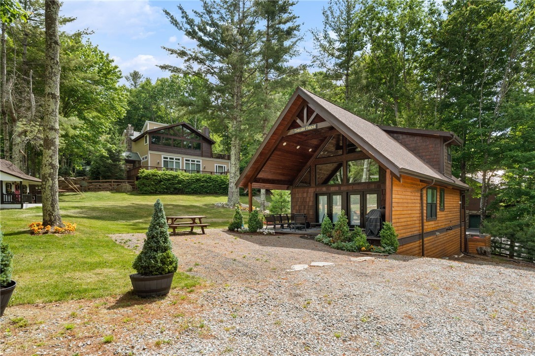 123 St Andrews Road Beech Mountain, NC 28604 - Photo 2 of 50 a front view of a house with garden