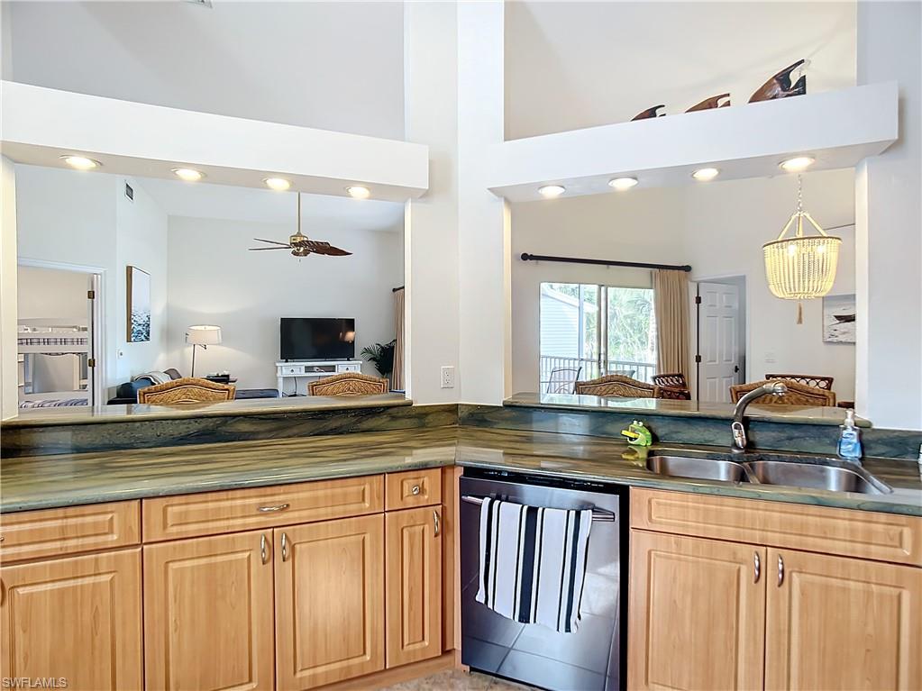 2860 Citrus Lake Drive, Unit R202 Naples, FL 34109 - Photo 12 of 50 a kitchen with lots of counter space and a sink