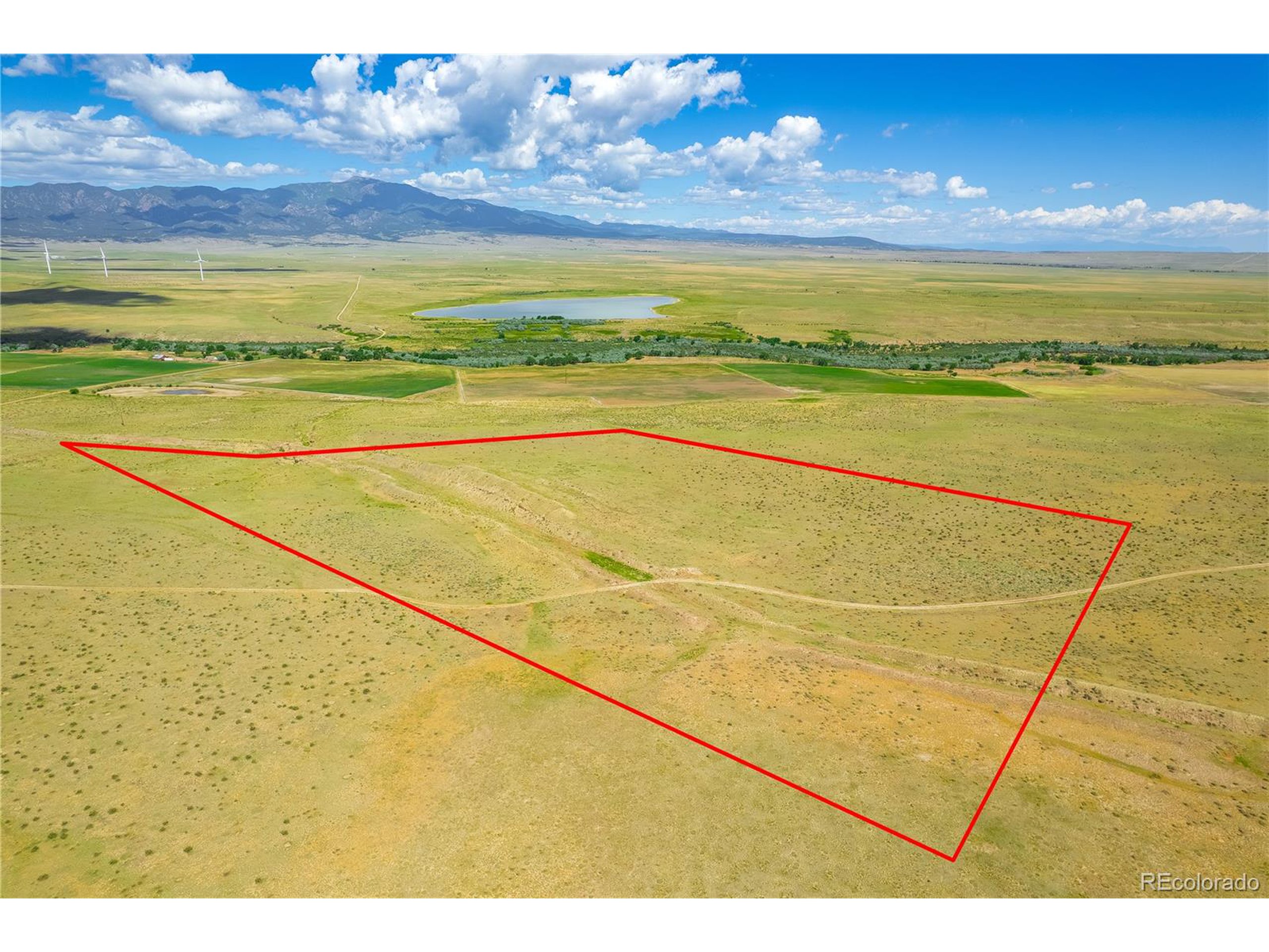 a view of an empty room with a ocean