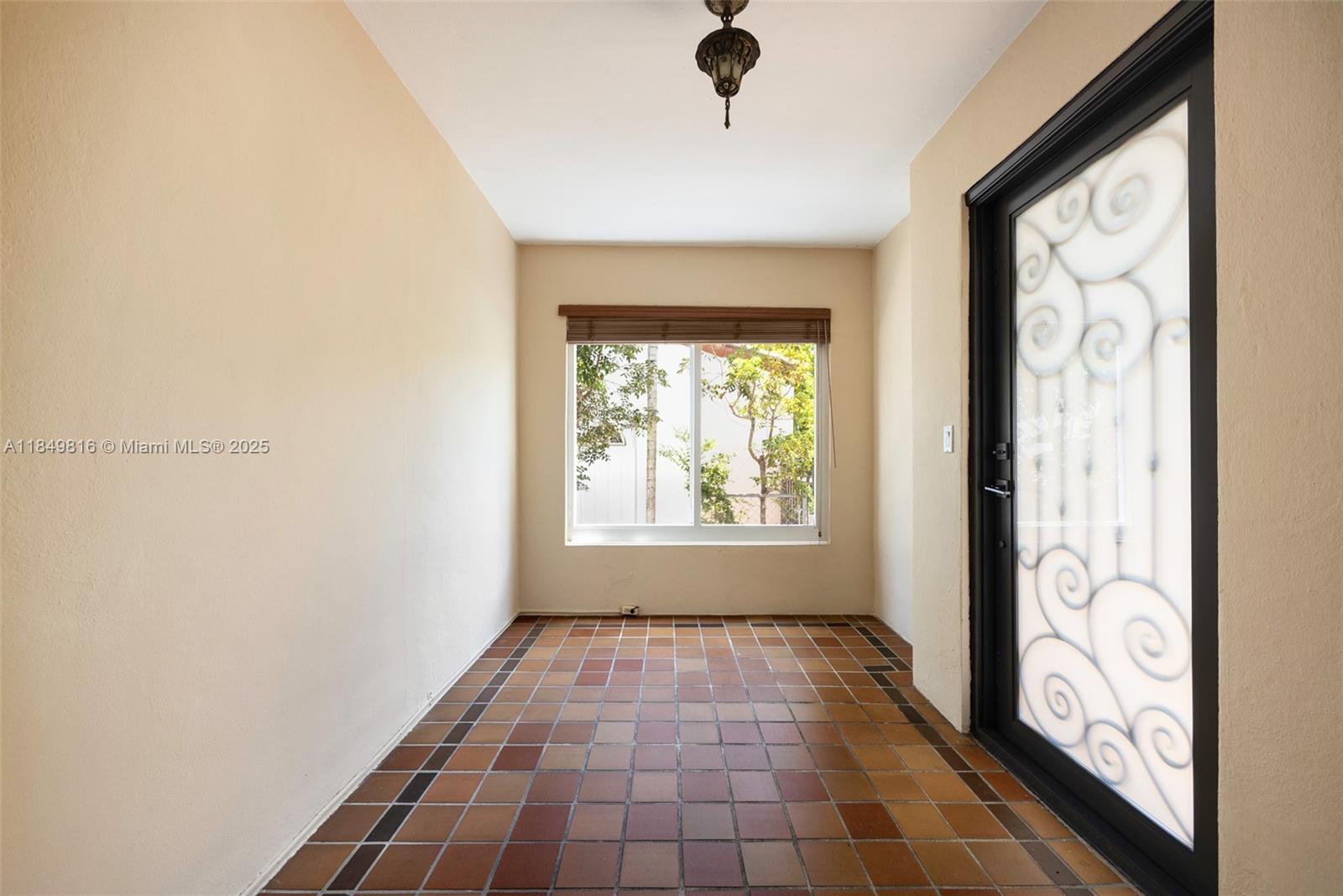 451 Southwest 25th Road Miami, FL 33129 - Photo 11 of 25 an empty room with windows