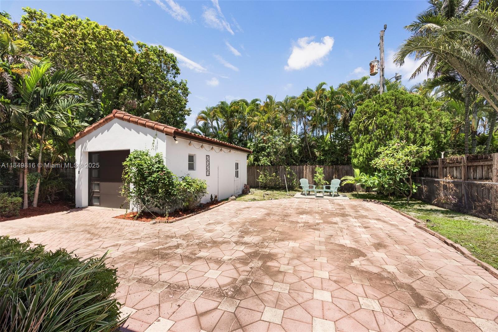 451 Southwest 25th Road Miami, FL 33129 - Photo 12 of 25 a view of a house with a yard and plant