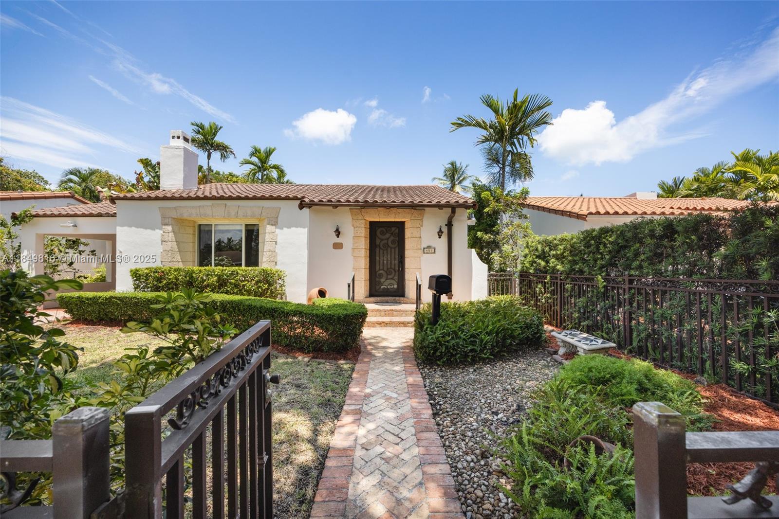 451 Southwest 25th Road Miami, FL 33129 - Photo 2 of 25 a front view of house with yard and green space