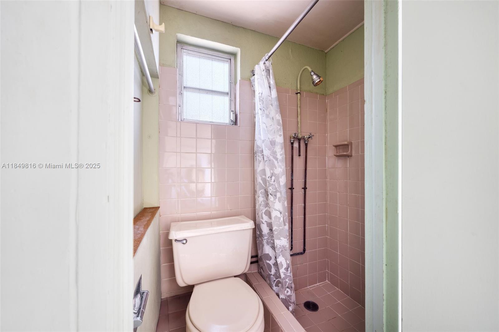 451 Southwest 25th Road Miami, FL 33129 - Photo 24 of 25 a bathroom with a toilet and a shower