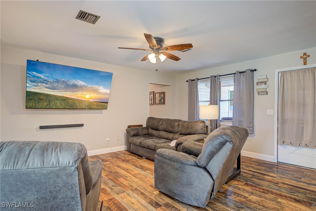 2970 Packinghouse Road Alva, FL 33920 - Photo 4 of 39 a living room with furniture and a flat screen tv