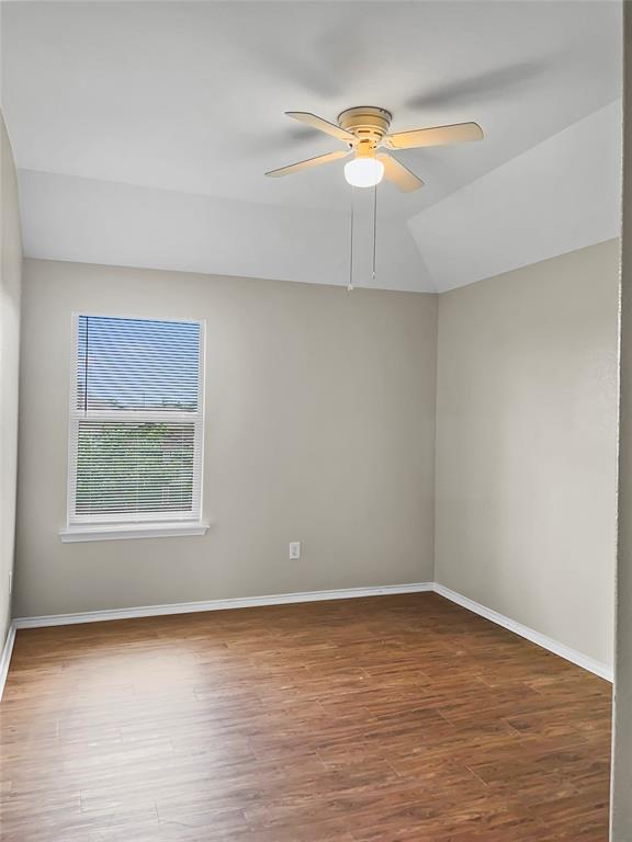 213 Long Prairie Drive Forney, TX 75126 - Photo 14 of 14 wooden floor in an empty room with a window