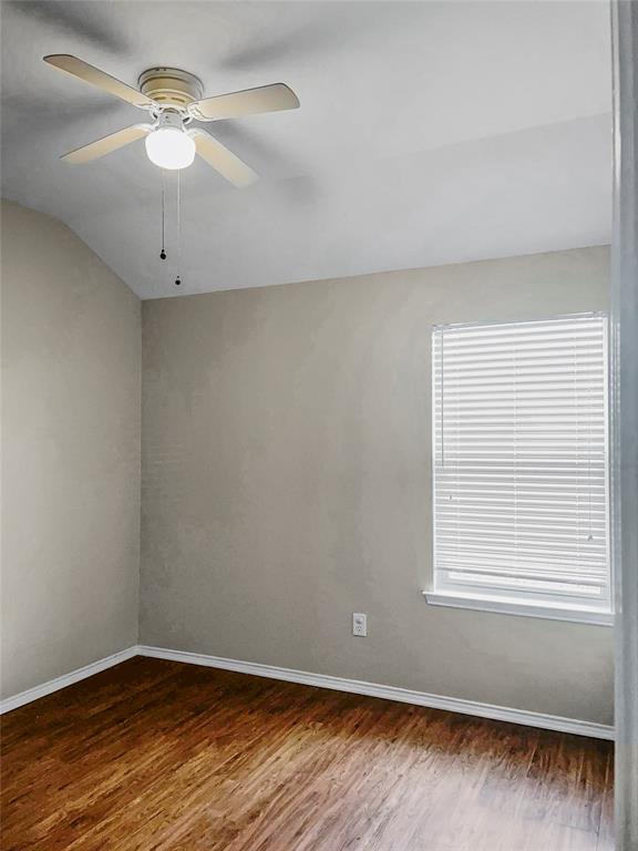 213 Long Prairie Drive Forney, TX 75126 - Photo 8 of 14 wooden floor in an empty room with a window