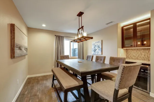 a view of a dining room with furniture window and wooden floor