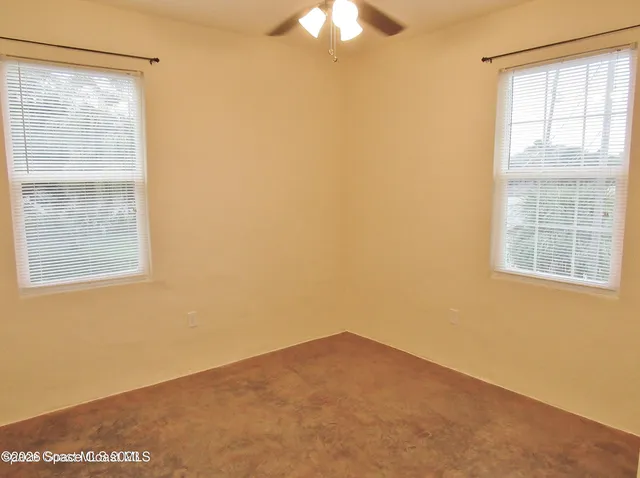 a view of a window in an empty room