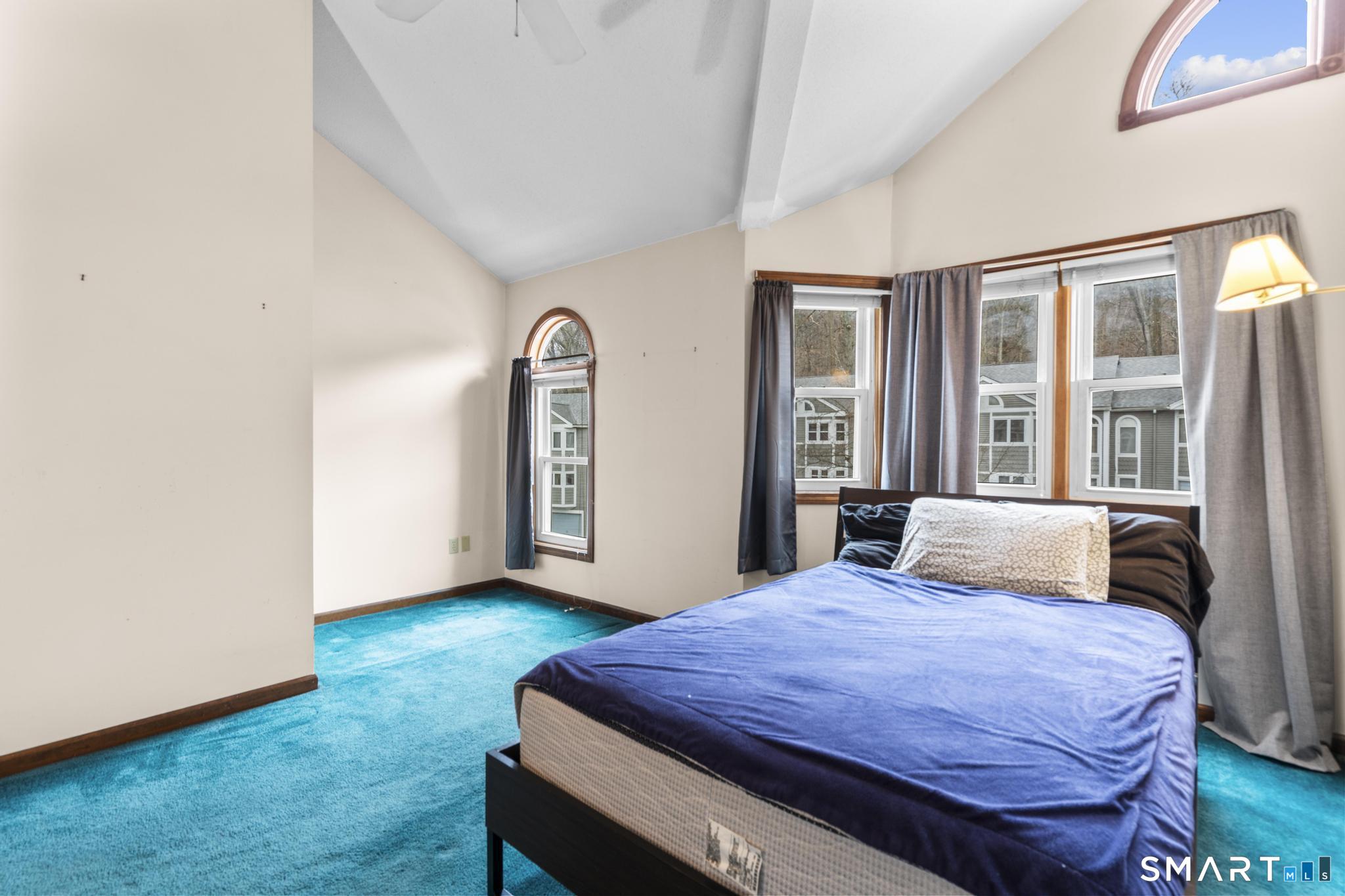 1655 North Colony Road, Unit 15 Meriden, CT 06450 - Photo 13 of 25 a bedroom with a bed and wooden floor