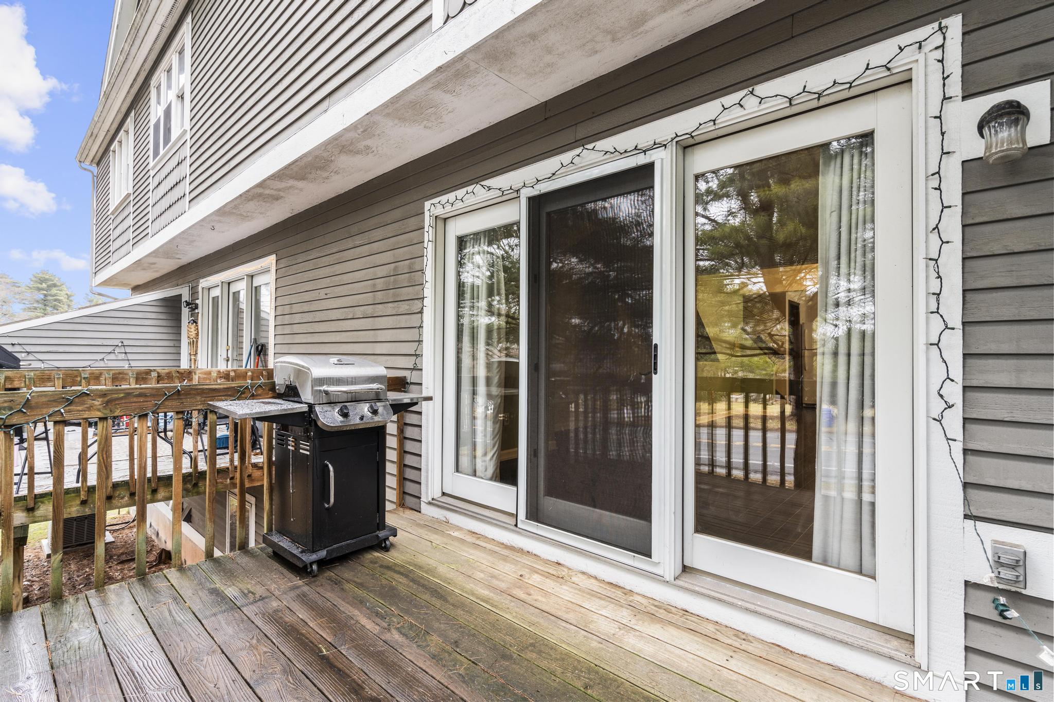 1655 North Colony Road, Unit 15 Meriden, CT 06450 - Photo 21 of 25 a view of a chairs on the deck