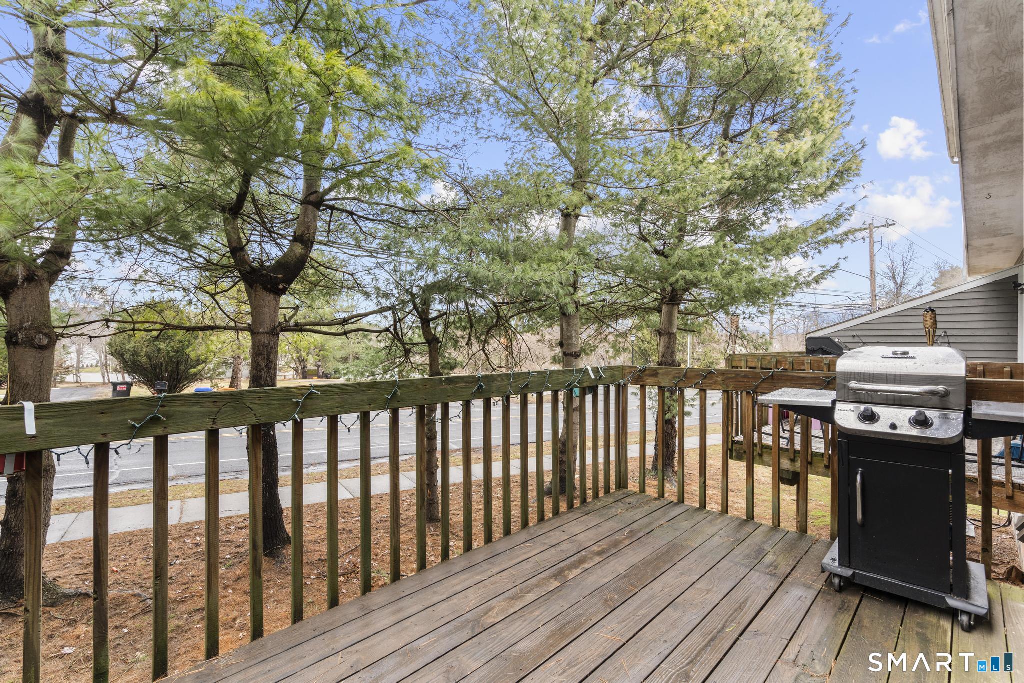 1655 North Colony Road, Unit 15 Meriden, CT 06450 - Photo 22 of 25 a view of a balcony with wooden floor