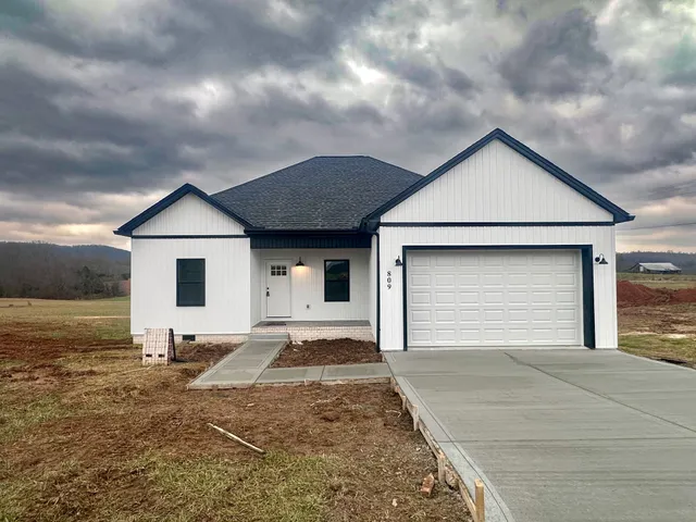 a front view of the house with yard