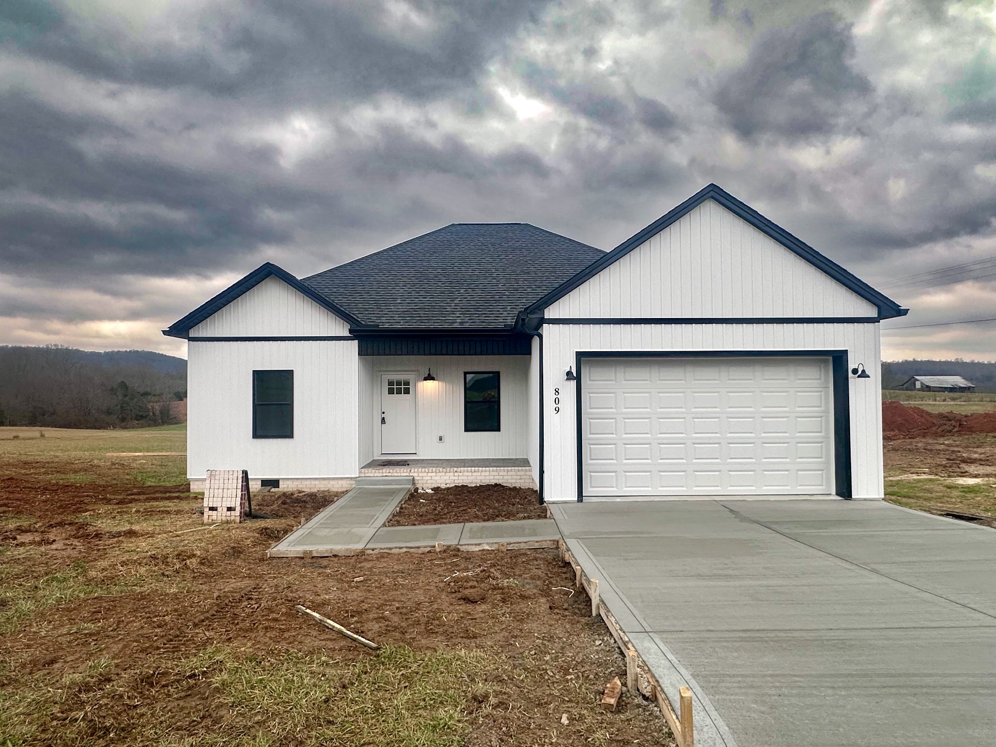 a front view of the house with yard