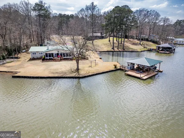 a view of a lake with boats and trees