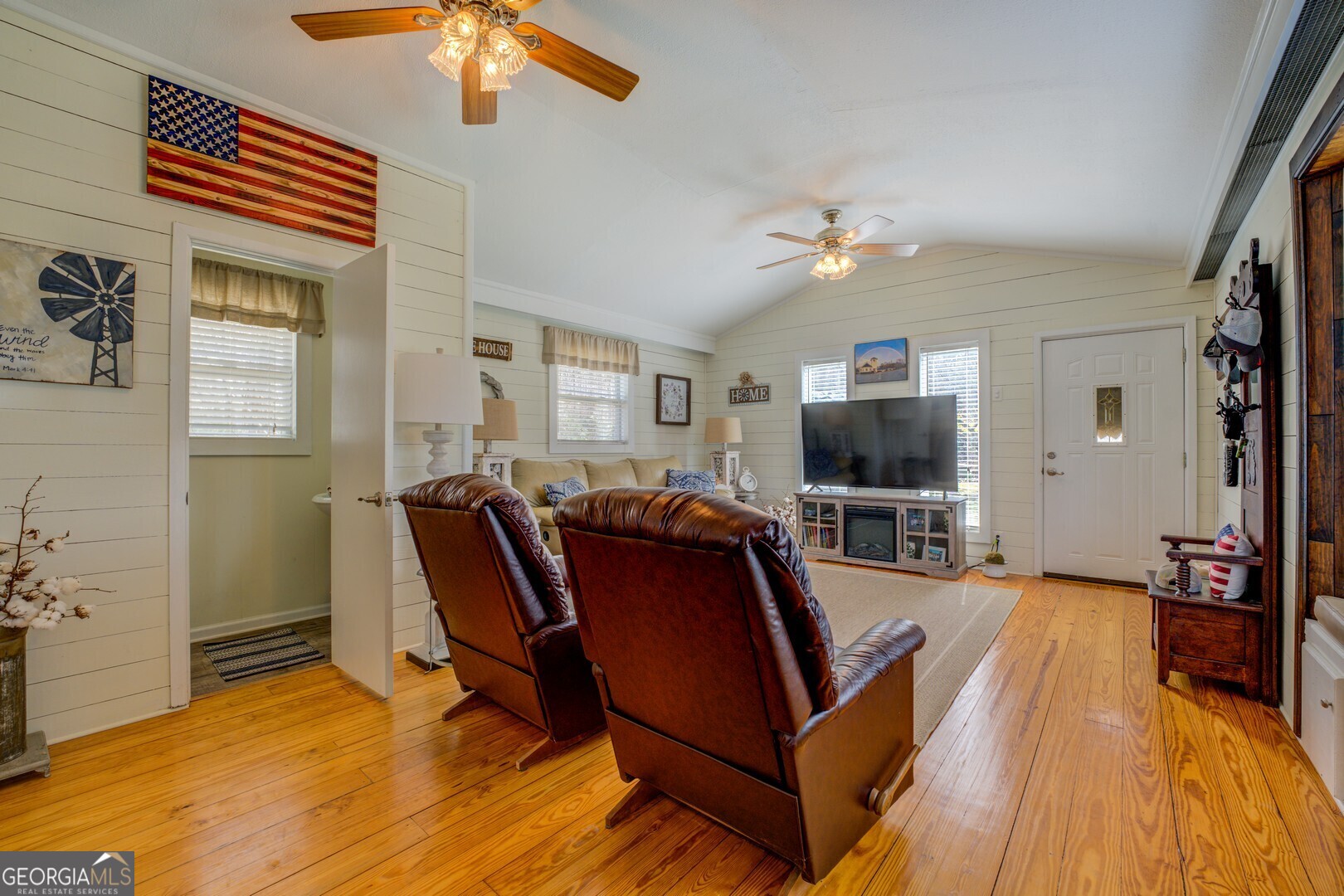 171 Blackberry Road Jackson, GA 30233 - Photo 21 of 78 a living room with furniture and a flat screen tv