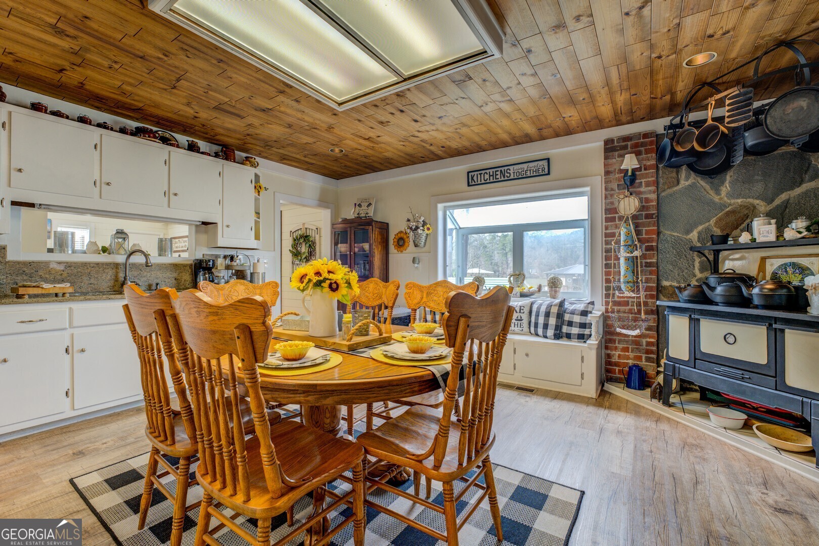 171 Blackberry Road Jackson, GA 30233 - Photo 24 of 78 a dining room with furniture a rug and wooden floor