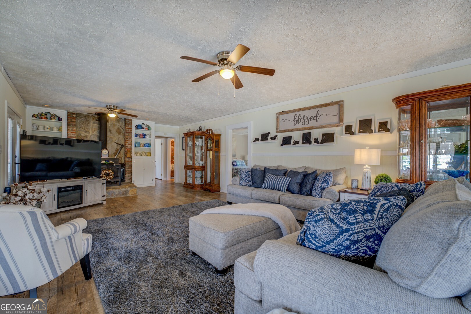171 Blackberry Road Jackson, GA 30233 - Photo 34 of 78 a living room with furniture and a flat screen tv
