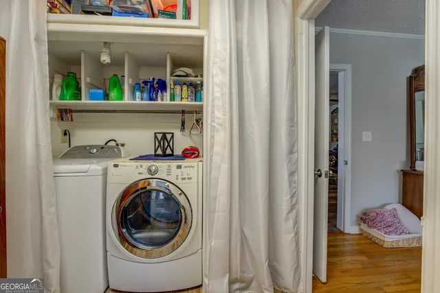 an aerial view of a house with a lake view