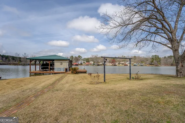 a view of a swimming pool with a table and chairs