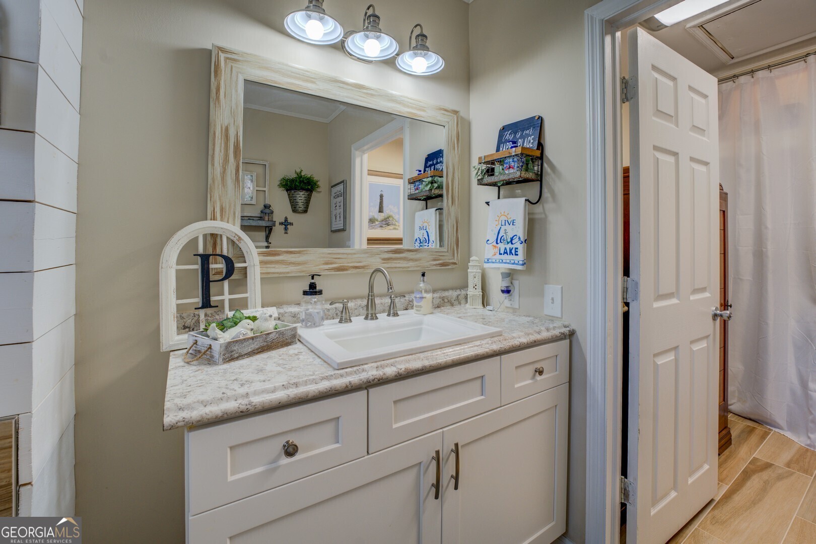 171 Blackberry Road Jackson, GA 30233 - Photo 46 of 78 a bathroom with a granite countertop sink and a mirror