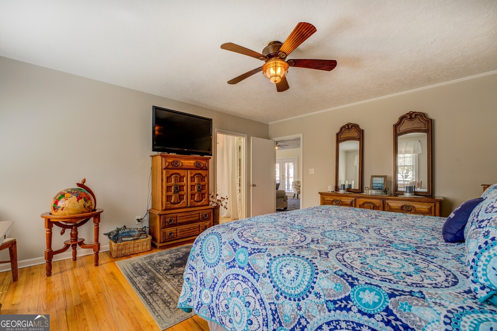 171 Blackberry Road Jackson, GA 30233 - Photo 47 of 78 a bedroom with a bed and a chandelier