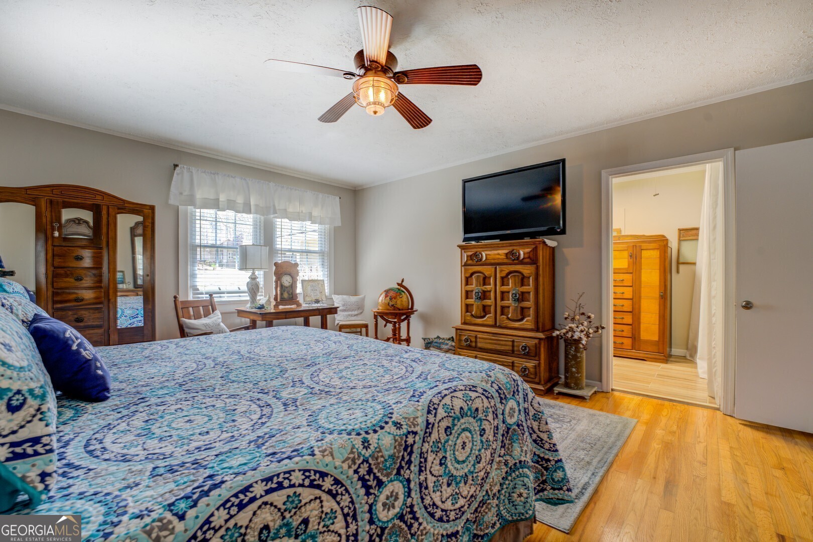 171 Blackberry Road Jackson, GA 30233 - Photo 48 of 78 a bedroom with a bed and a flat screen tv
