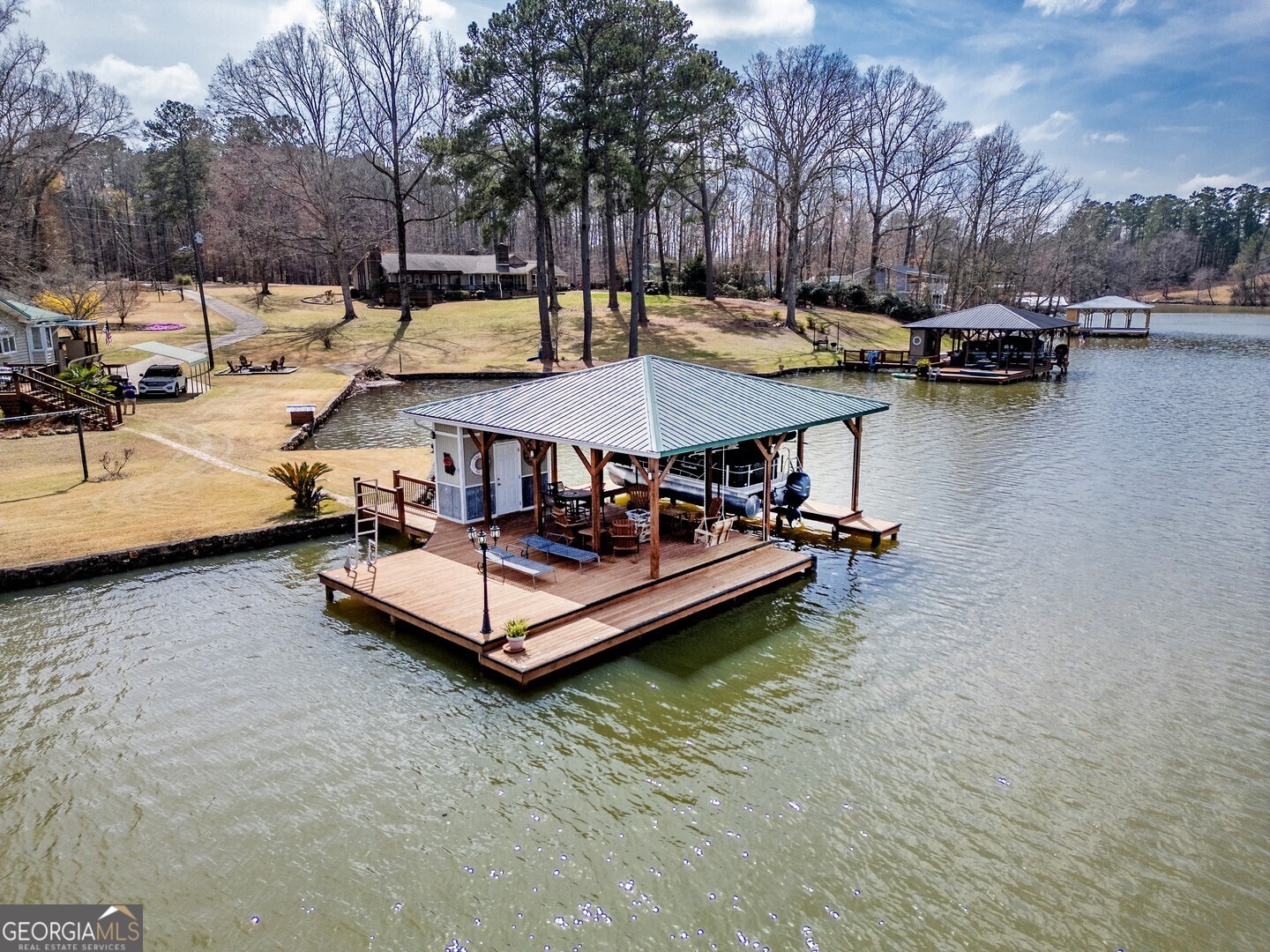 171 Blackberry Road Jackson, GA 30233 - Photo 5 of 78 a view of a swimming pool with a patio and a yard