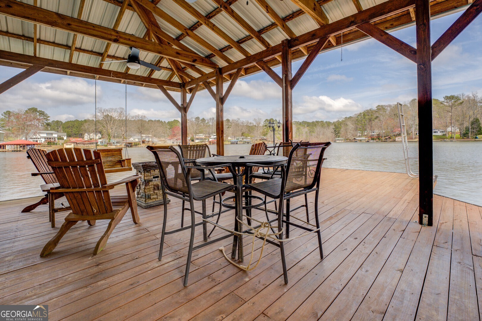 171 Blackberry Road Jackson, GA 30233 - Photo 6 of 78 a view of a swimming pool with a table and chairs