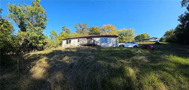 a backyard of a house with lots of green space