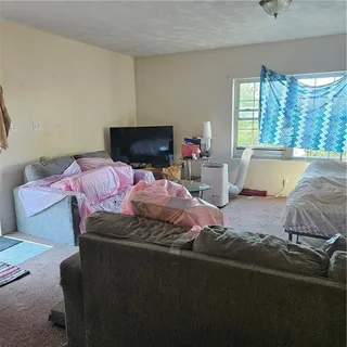 a bedroom with bed and a window